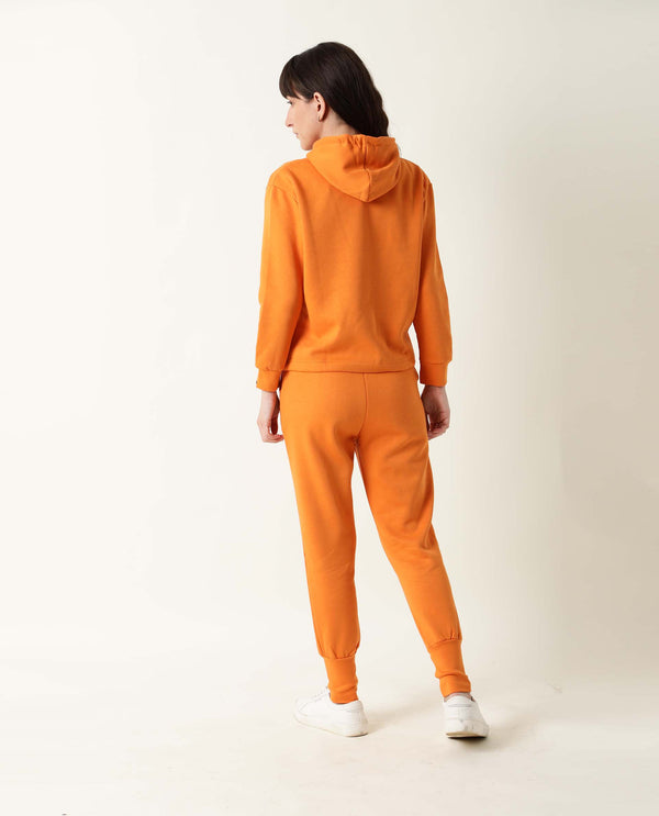 Rareism Women Simp-1 Orange Poly Cotton Fabric Tailored Fit Solid Mid Rise Ankle Length Track Pant