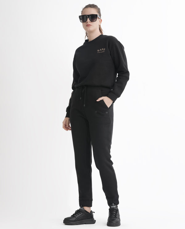 Rareism Women Terac F Black Poly Cotton Fabric Regular Fit Solid Mid Rise Ankle Length Track Pant