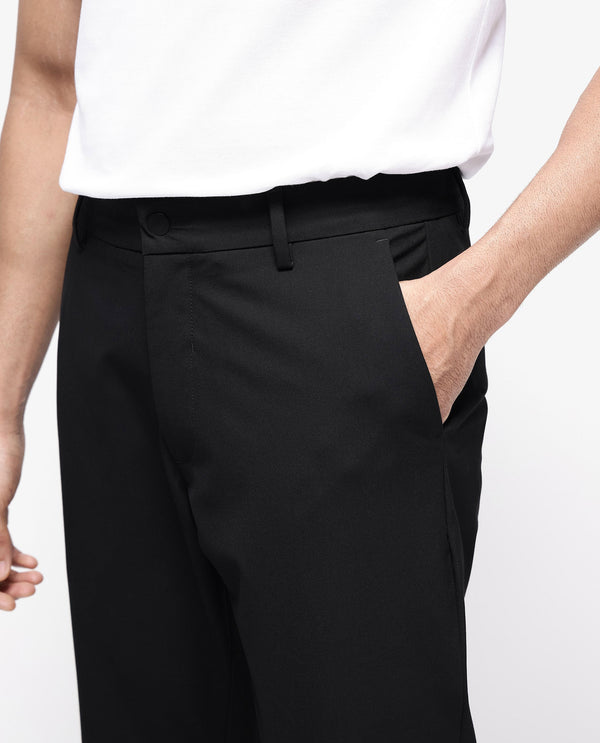 Rare Rabbit Men Travel-25 Black Polyester Viscose Lycra Fabric Button And Zip Closure Regular Fit Solid Trousers