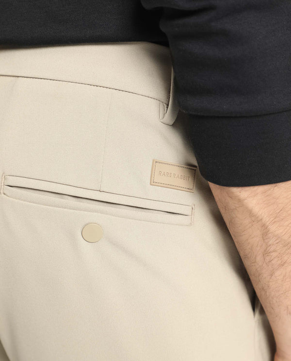 Rare Rabbit Men's Traveller Beige Solid Mid-Rise Regular Fit Trouser