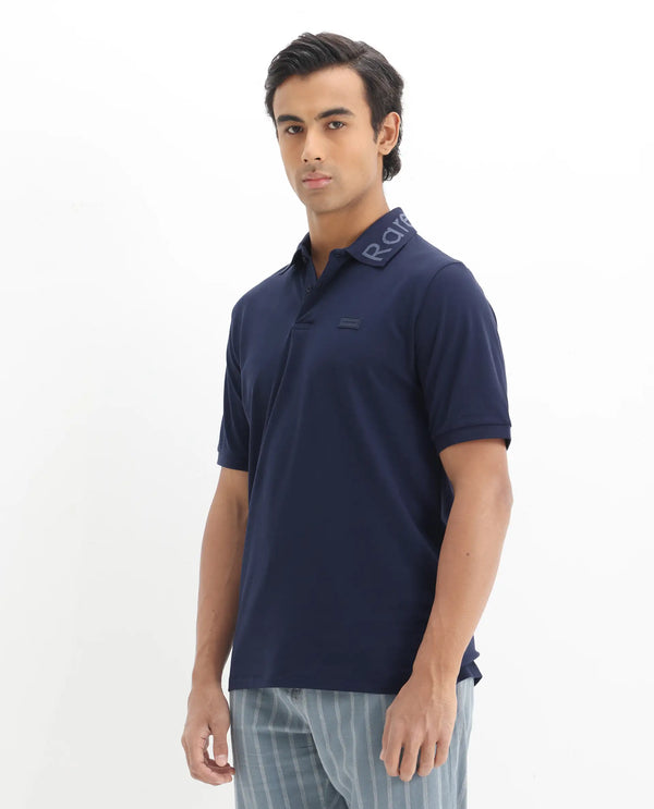 Rare Rabbit Men Vinc Navy Cotton Fabric Short Sleeve Silicon Badge Button Closure Plain Polo