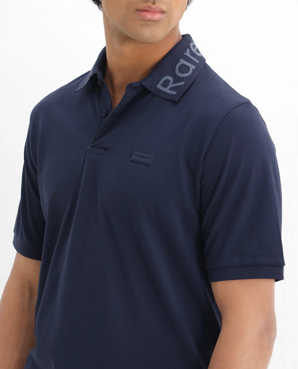 Rare Rabbit Men Vinc Navy Cotton Fabric Short Sleeve Silicon Badge Button Closure Plain Polo