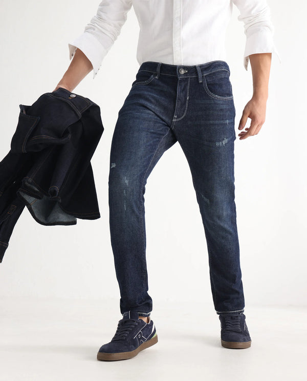 Rare Rabbit Men Yuri Dark Blue Cotton Spandex Fabric Slim Fit Mid Wash Distressed Solid Denim Pant
