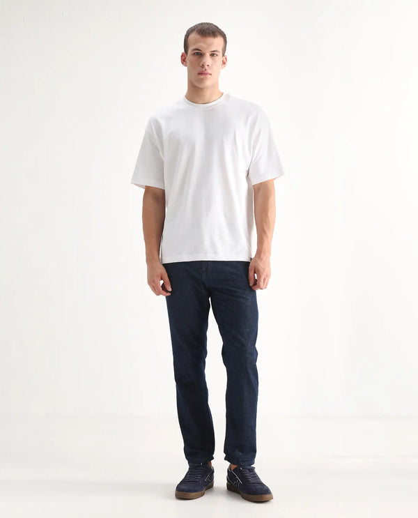 Rare Rabbit Men Gleb Dark Blue Cotton Fabric Mid Rise Carrot Fit Mid Wash Plain Denim Trousers